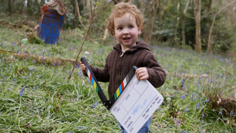 Young talent using the clapper board on the TV Advert Production